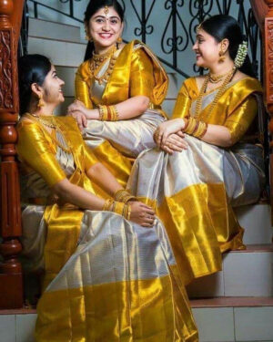 Off-white wedding silk saree in 12 inches mustard gold zari border