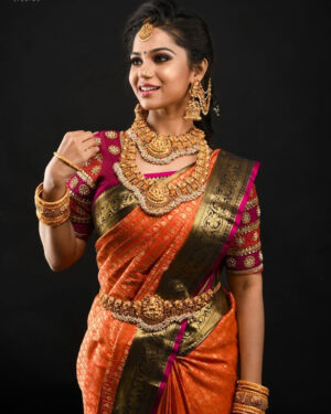 Orange kanchipuram saree in 6 inches black border with pink edge lining