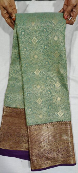 0H0H1004 Pista green kanchi pattu sarees in wine border